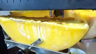 LONDON STREET FOOD, BOROUGH MARKET, SWISS RACLETTE, MELTED CHEESE OVER BOILED POTATOES