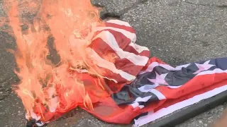 Counterprotesters burn Confederate flag in Stone Mountain