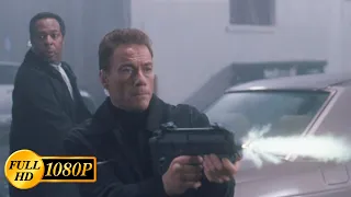 Jean-Claude Van Damme fights off bandits in a car with a submachine gun / The Hard Corps (2006)