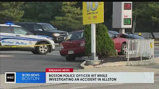 Boston police officer hit by car while investigating crash near gas station