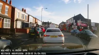 Chilling footage shows moment cyclist appears to stab car passenger with giant knife