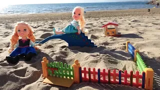 Elsa and Anna toddlers at the beach playground