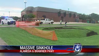 Huge sinkhole appears next to Taylor Shopping Center