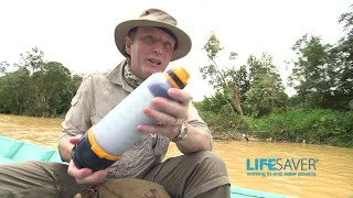 LifeSaver 4000UF bottle purifying water on the Borneo River