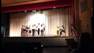 Kid sing "Bohemian Rhapsody" at school concert.