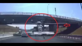 Apache helicopter flying under overpass on busy highway in Israel