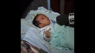 baby coughing into a mic