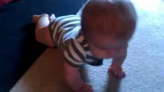 My son's first steps at learning how to crawl