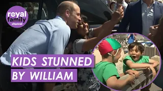 Prince William poses for selfies with public on the beach