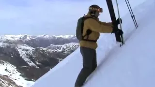 Putting skis on in a steep slope.mp4