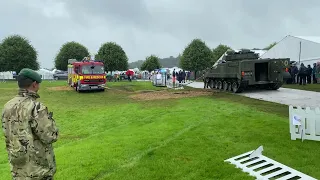 Burning Man :: See how a British Army Tank deals with this mud stuck fire engine at UK festival.