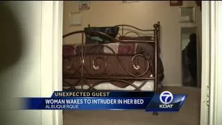 Woman wakes to intruder in bed