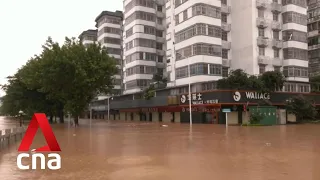 Tens of thousands evacuated as floods hit southern China