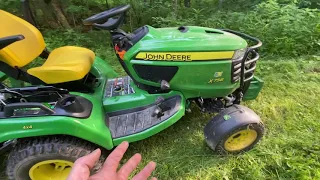 Brush hogging out in the woods with a John Deere x758