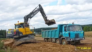 Loading Tatra 815-2 8x8 truck with the Volvo EW160C wheeled excavator