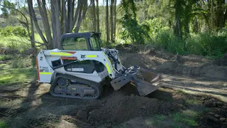 Purpose of a 4-in-1 Bucket on a Skid Steer Loader