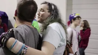 Chris Chan kissing a guy on the cheek at Too Many Games