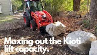 Maxing out the Kioti lift capacity moving HUGE boulders for a retaining wall!!!