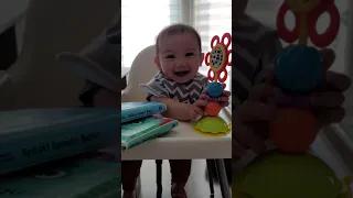Baby Theo is so happy in his high chair