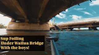 Sup Foiling under Wailua Bridge, Kaua'i after a flood.