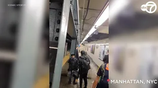 Video: Flood waters gush into NYC subway stations