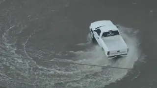 Driver does donuts in the Los Angeles River