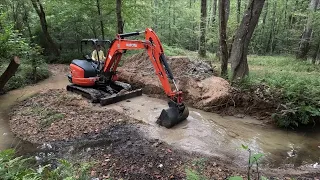 Straightening a creek run out with a mini excavator