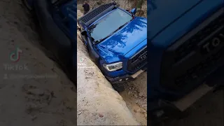 Would you Look at this?? Overland Tacoma on its side rock crawling