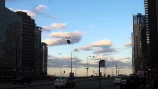 Military helicopters flying low over Chicago River