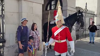 Queen's Guard Shouts stand clear young boy jumps #horseguardsparade