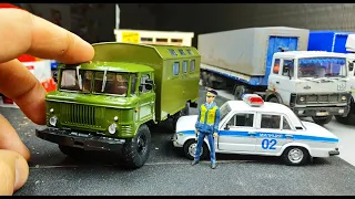 Модель грузовика ГАЗ 66 и фигурка ДПСника 1/43. Легендарные грузовики Модимио №3 распаковка и обзор!