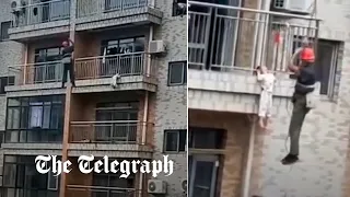 Construction worker rescues child dangling from balcony on 6th floor