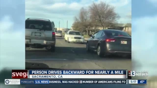 Car drives backwards on California highway