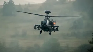 Apache Longbow attack helicopter landing during heavy rainfall