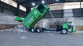 Garbage truck unloading at the dump