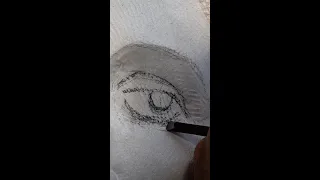 Carving an eye in stone