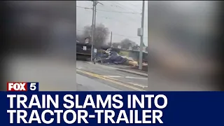 Train slams into tractor-trailer