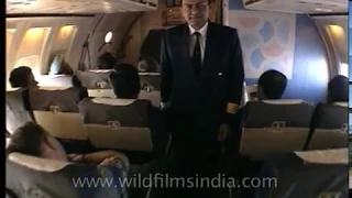 Pilot engages auto-pilot, emerges from cabin, walks through Indian East West aircraft aisle