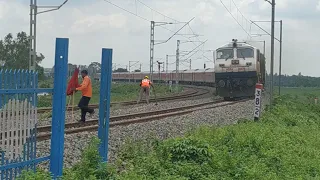 High Speed Rajdhani express of Indian Railway Passing Through Rail Gate