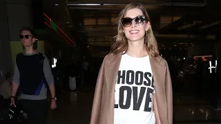 Rosamund Pike Flashes Her Perfect Smile At LAX