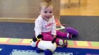 Infant Learns to Play with Pull-Toy at Apple Montessori Schools