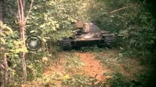 M-48 tanks fire machine guns and soldiers take out a tank stuck in dense bamboo g...HD Stock Footage