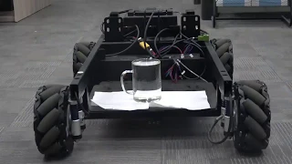 mecanum platform with full glass of water