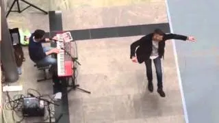 Man going a dance in  Shopping Center