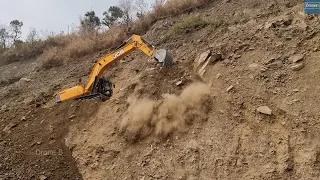 Rolling Down Boulders and Dust as Flood While JCB Excavator Clearing Landslide Road Dirt