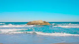 Beautiful sea and huge rocks. cheerful sound of waves