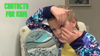 9 year old putting in contact lenses for the first time!