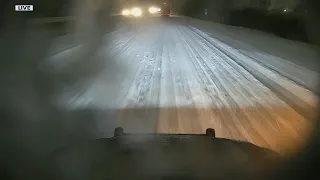 Road report from I-75 where ice lies beneath snow covered lanes