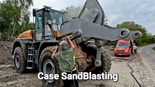 Grit Blasting paint & Rust off a wheel loader to restore and accept new paint