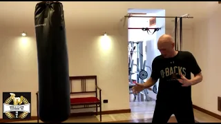 Martial Arts Tips - Open up your opponents door for the backfist with World Champion Kman McEvoy